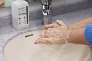 a person washing her hands