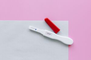 white and red pregnancy test kit