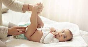 Caregiver changing baby's diaper - Baby diaper changing