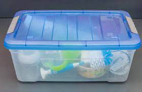 Baby feeding items inside a closed container undergoing sterilization.