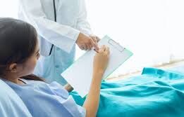 A healthcare professional showing a patient their medical report, explaining the details.