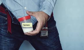 Man holding container of sperm for analysis and fertility assessment during men's health clinic