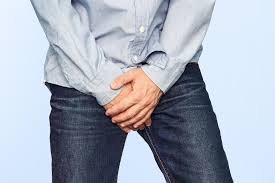 Men's health: Man wearing blue jeans and shirt posing for a photo