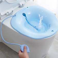 A sitz bath kit positioned on a toilet, with necessary components for a soothing soak.