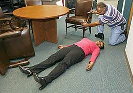 Unconscious Person: Bystander Clearing Room Around Woman on Floor