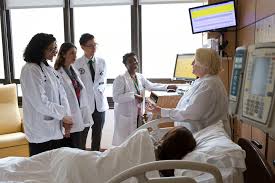 Expectant mother receiving care in the antenatal ward during doctors rounds
