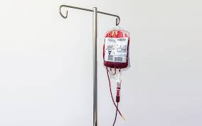 Bag of blood hanging on an IV pole for blood transfusion for treating anemia