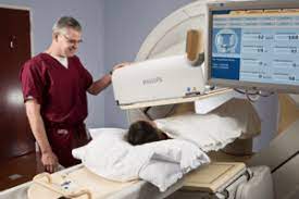 A patient receiving a thyroid uptake scan for diagnostic exams purposes.