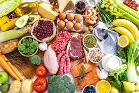 A vibrant display of assorted heart-healthy foods, including colorful fruits, vegetables, nuts, and whole grains, promoting cardiovascular wellness and disease prevention.