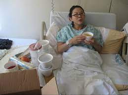 Postpartum patient enjoying breakfast in bed
