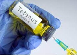 Healthcare professional preparing to administer a tetanus shot for protection against lockjaw.