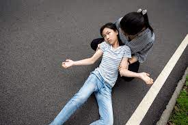 Epilepsy Disorder: Child experiencing seizure activity on the road.