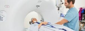  Person undergoing CT scan procedure.