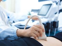 Ultrasound scan of the abdomen in progress