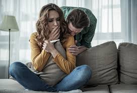 Couple reading pregnancy test together