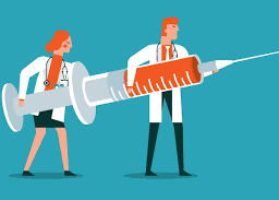 Two healthcare professionals holding up syringes, ready to administer flu shots.