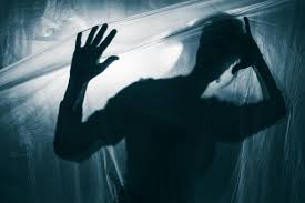 Person trapped behind a plastic screen trying to get out