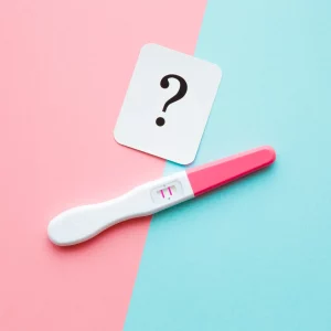 An image of a positive pregnancy test showing two clear lines or a plus sign, indicating a confirmed pregnancy. The test is placed on a clean surface, with a simple background to highlight the result. The image symbolizes a moment of positive news and is often associated with early pregnancy confirmation.