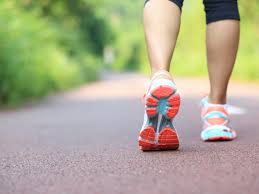 Person wearing sneakers taking a daily walk outdoors