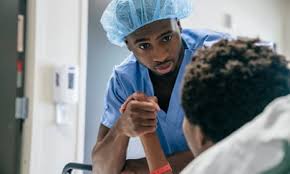 Nurse Offering Comfort - A heartfelt image of a nurse holding the hand of a patient, exemplifying compassion and support in healthcare.