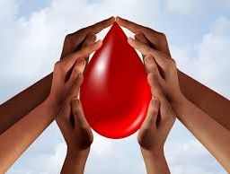 Hands join together around a symbolic drop of blood, representing unity and support for blood donation. This powerful image highlights the collective effort needed to save lives and promote community health through donations.