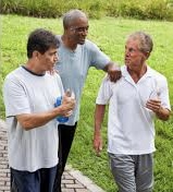 Three men engaging in conversation