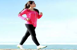 Woman taking a daily walk near the beach