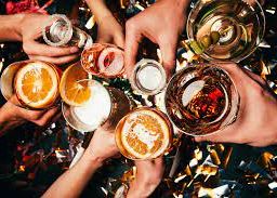 Alcohol consumption: People in a Group Toasting Together.