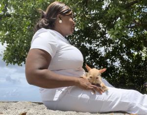 Woman and Pets enjoying a serene beach moment