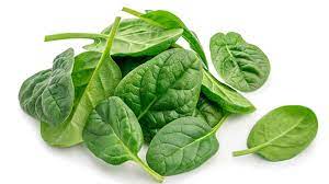Fresh spinach leaves, a key ingredient for enhancing energy levels in meals.