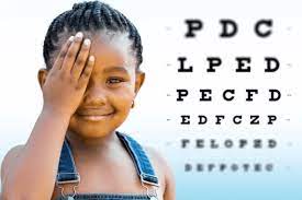 Female child undergoing a Children's Eye Health vision exam.