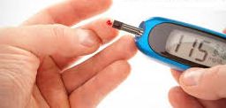 Image of a person using a glucometer to check their blood sugar level, an essential step in managing diabetes.