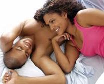 Happy couple sharing a moment of intimacy, smiling warmly at each other.