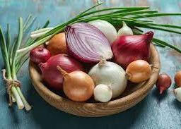 A basket brimming with fresh onions, showcasing the health benefits and culinary versatility of this nutrient-rich vegetable.