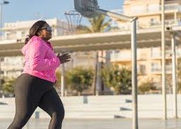 Woman in black tights and pink jacket training to boost memory and brain function