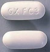 A close-up view of Zidovudine (AZT) tablets, commonly used in HIV treatment and prevention of mother-to-child transmission.