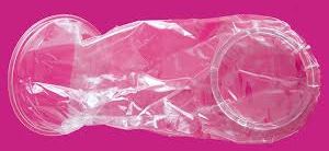  image of a female condom on a pink background.